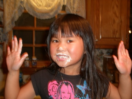 Kasen with cake batter on face and hands